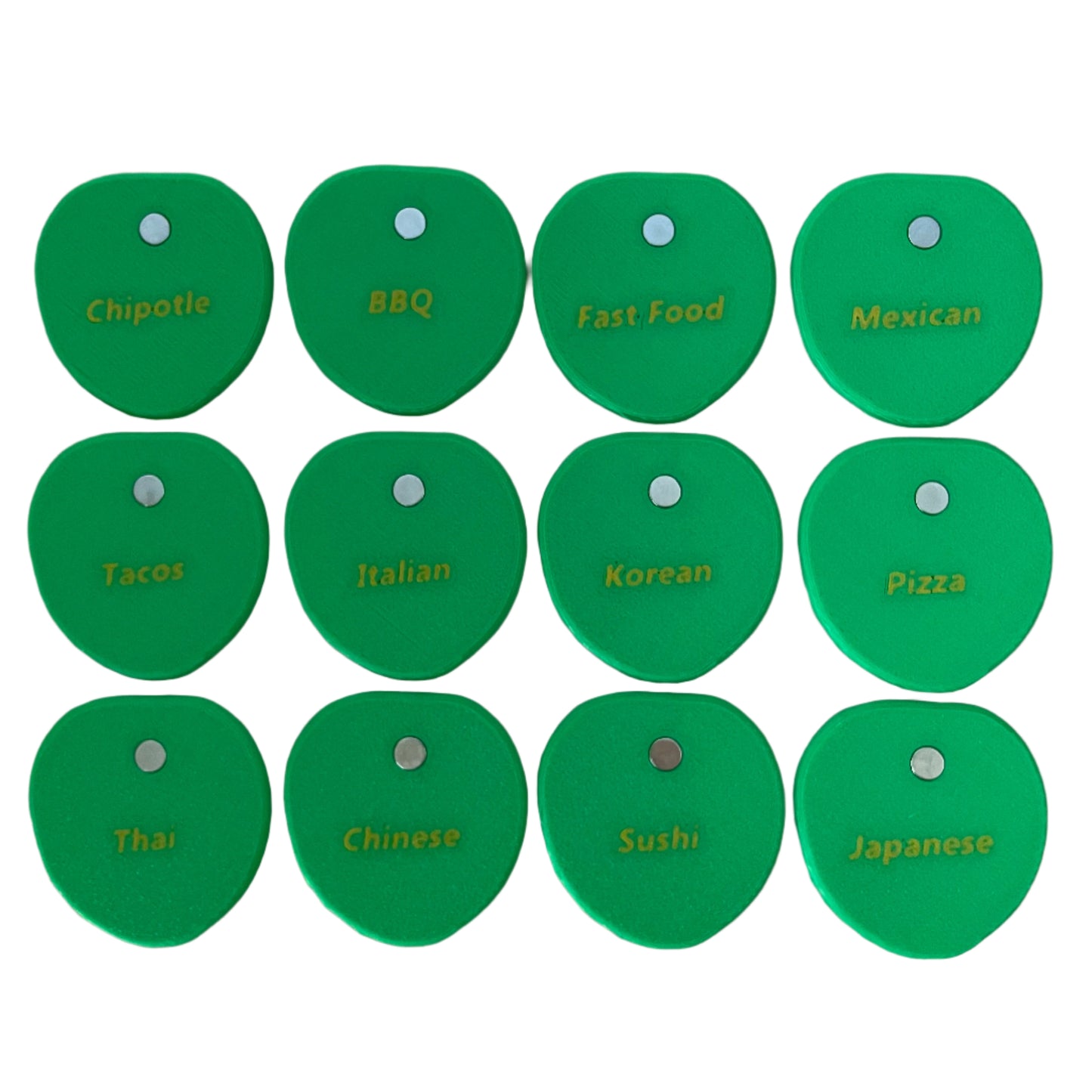Set of green 3d printed pilea leaves labeled with various food categories on a white background
