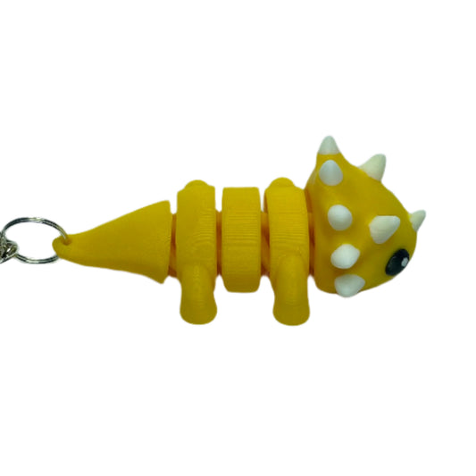 3D printed flexible gold triceratops keychain fidget toy