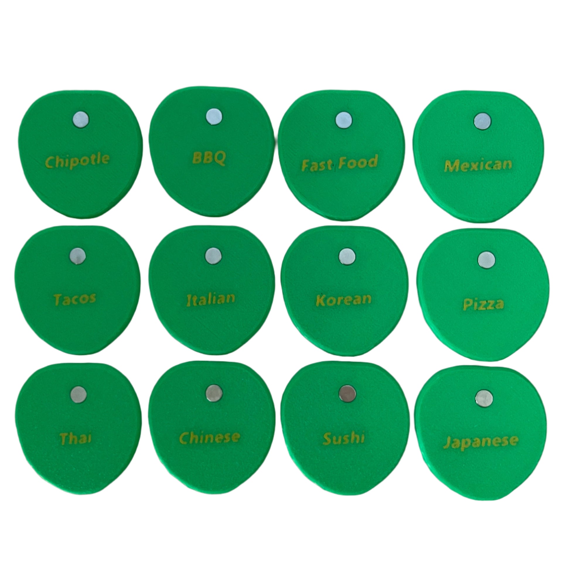 Set of green 3d printed pilea leaves labeled with various food categories on a white background