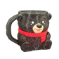 Black bear-shaped mug with a red scarf 
