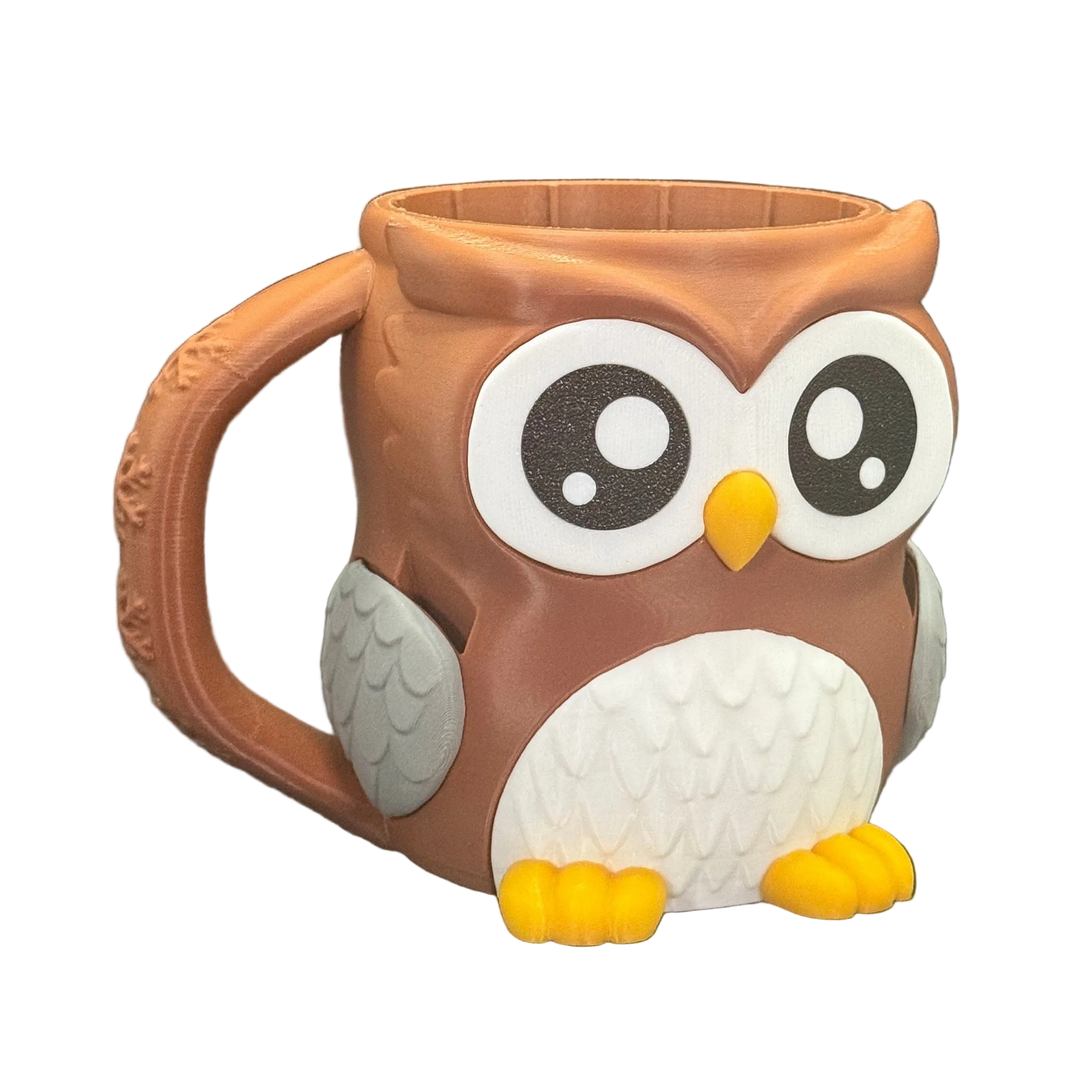 Owl-shaped mug with a brown body, white face, and yellow beak on a white background